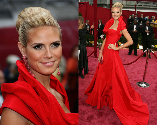 Heidi Klum went bold with a dramatic red silk taffeta John Galliano gown and