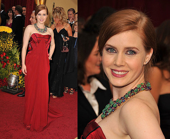 Amy Adams graced us with her presence wearing a strapless red Carolina 