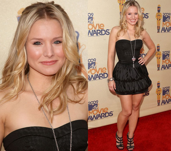 Kristen Bell posed pretty in a black silk bustier dress and studded Jimmy 