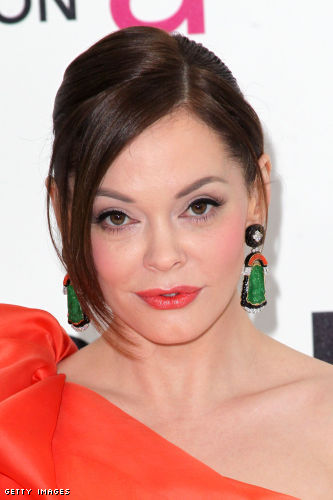 and orange statement earrings by David Webb, an emerald ring by David