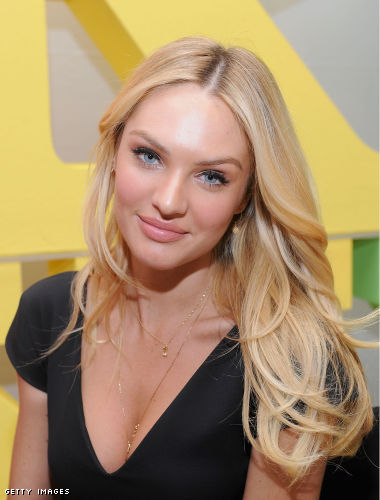 Candice also kept her hair down in slightly wavy curls with pretty makeup 
